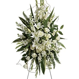 White floral standing spray on an easel