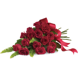 Spray of long-stem red roses tied with a red satin ribbon