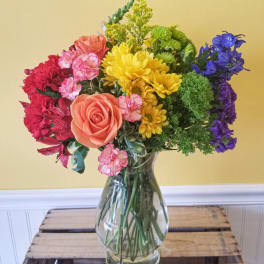 Colorful mixed bouquet in a clear glass vase