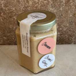 Jar of homemade honey with cinnamon and creamed honey labels
