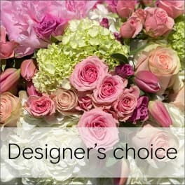 Pink roses and hydrangeas with tulips in a designer's choice bouquet