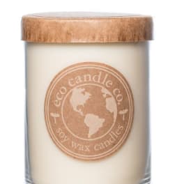 Soy wax candle in a glass jar with a wooden lid