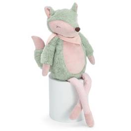 Plush fox toy sitting on a white cylinder