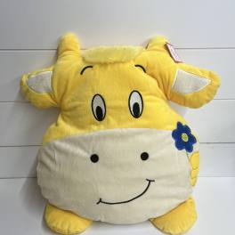 Yellow plush cow pillow with a smiling face and blue flower detail
