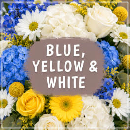 Blue, yellow, and white flower arrangement with roses, daisies, and hydrangeas