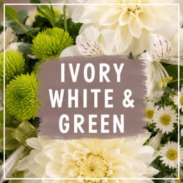 Ivory and white flowers with bright green blooms in a close-up arrangement