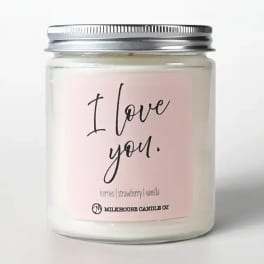 Pink candle in a glass jar with a metal lid and "I love you" label