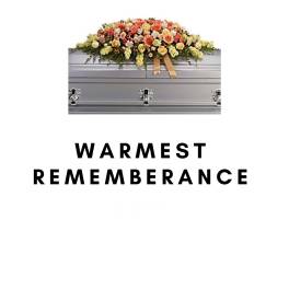 Flower-covered silver casket with a warm-toned spray