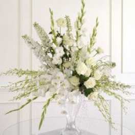 White floral arrangement in a clear glass vase