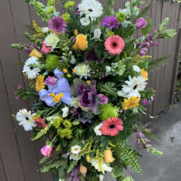 Tall mixed flower standing spray with gerberas, roses, and snapdragons