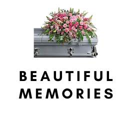 Pink floral spray on a silver casket with the words Beautiful Memories below