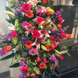 Large mixed bouquet with pink roses, lilies, and purple flowers