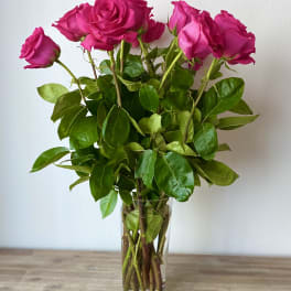 Pink roses in a clear glass vase