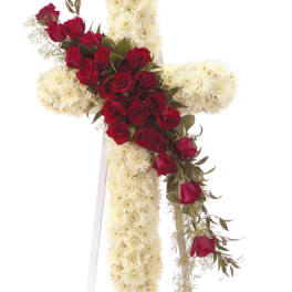 Red roses arranged in a cross with white flowers