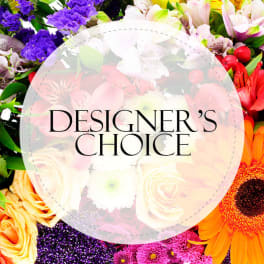 Assortment of brightly colored mixed flowers with the text Designer's Choice in a translucent circle