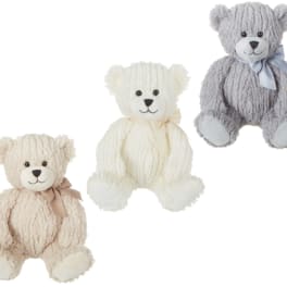 Three plush teddy bears in cream, white, and gray with ribbons