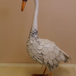 Decorative white swan figurine with orange beak and feet