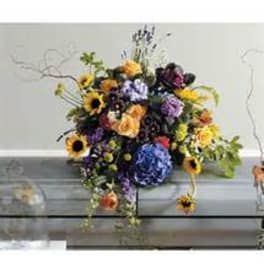 Mixed bouquet with sunflowers, purple blooms, and orange flowers