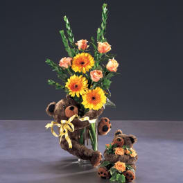 Flower arrangement with yellow gerberas and peach roses, plus two teddy bears