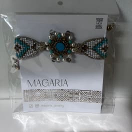 Beaded bow-shaped jewelry on a card in clear packaging