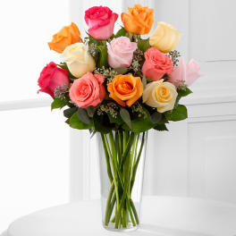 Mixed roses in a clear glass vase