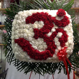 Large red and white floral standing display with a ribbon bow