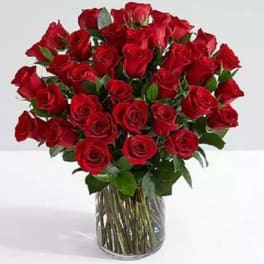 Bouquet of red roses in a clear glass vase