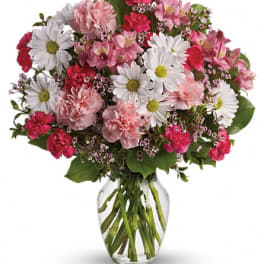 Pink and white mixed bouquet in a clear glass vase