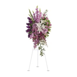 Tall purple and white floral spray on a stand
