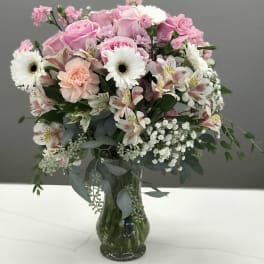 Pink and white mixed bouquet in a glass vase