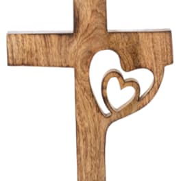Wooden cross with a heart cutout on a base