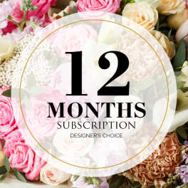 Pink and cream roses with carnations behind a 12 months subscription label