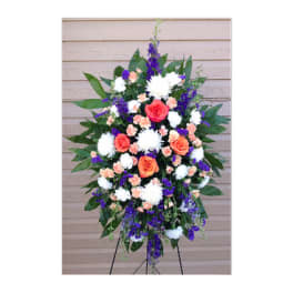 Standing floral spray with orange, white, and purple flowers