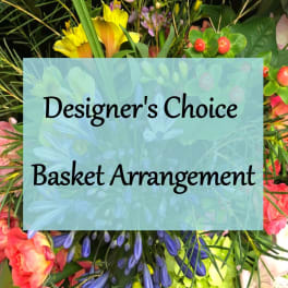 Designer’s choice basket arrangement with mixed colorful flowers
