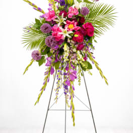 Tall standing floral spray with pink, purple, and white flowers
