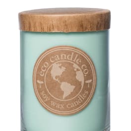 Mint-green candle in a glass jar with a wooden lid