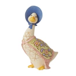 Decorative duck figurine wearing a blue bonnet and floral shawl
