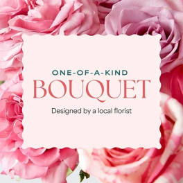 Pink roses surrounding a centered bouquet label