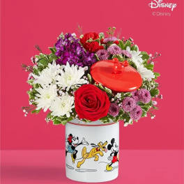Bouquet of mixed flowers in a Disney character tin container