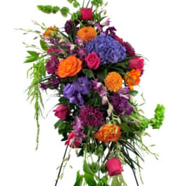 Tall colorful standing floral spray on an easel