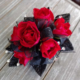 Bouquet of red roses with black ribbon accents