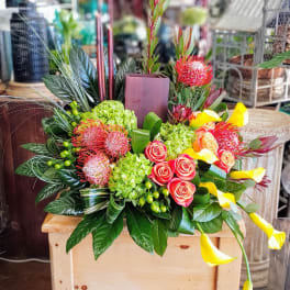 Mixed bouquet with pink roses, green hydrangeas, and yellow calla lilies