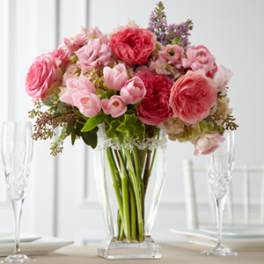 Pink and red flower bouquet in a clear glass vase
