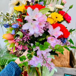 Mixed bouquet of colorful flowers in a glass vase