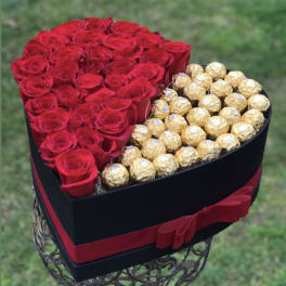 Heart box with half red roses and half chocolate