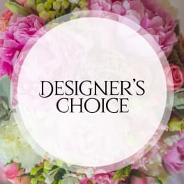 Pink floral arrangement with a "Designer’s Choice" label