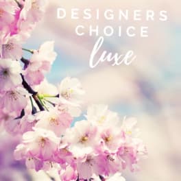 Pastel image of pink cherry blossom-style flowers with text reading Designers Choice Luxe