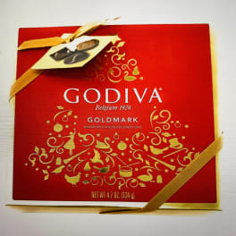 Red Godiva chocolate gift box with gold ribbon