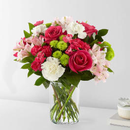 Pink and white mixed bouquet in a clear glass vase
