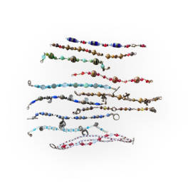 Assorted beaded bracelets laid out on a white background